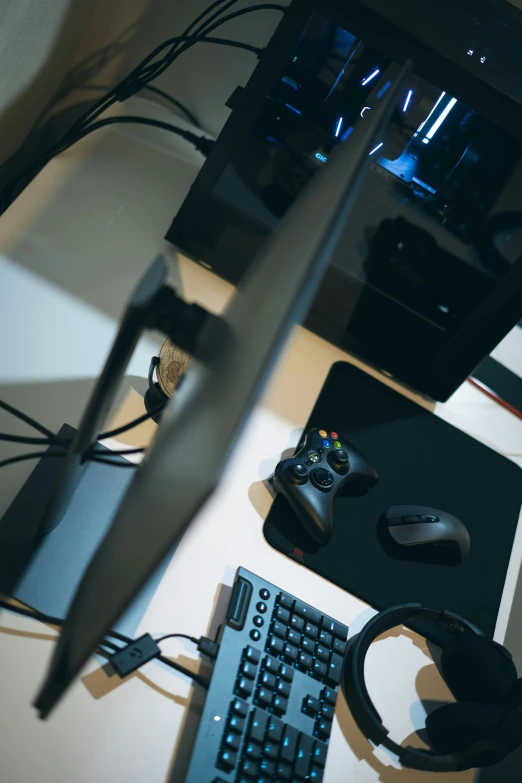 two controllers and some cables on a table