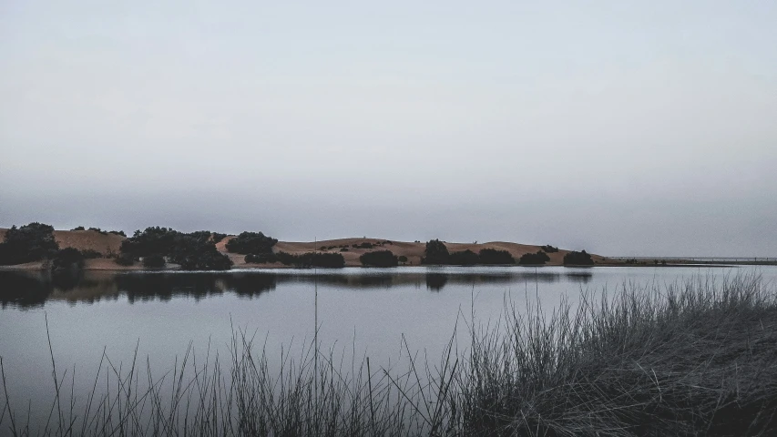 the water has calm waves in the sky