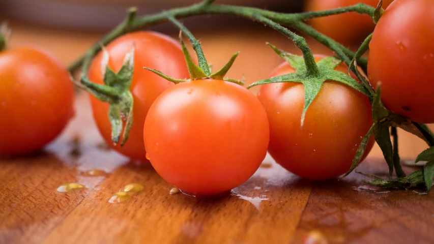 fresh tomatoes sitting on a table ready for harvest