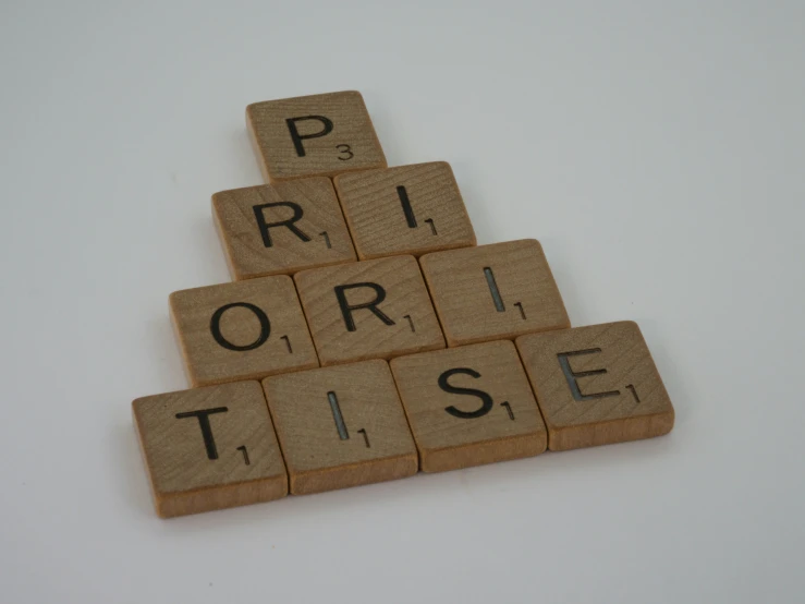 a scrabble tile christmas tree on top of a table