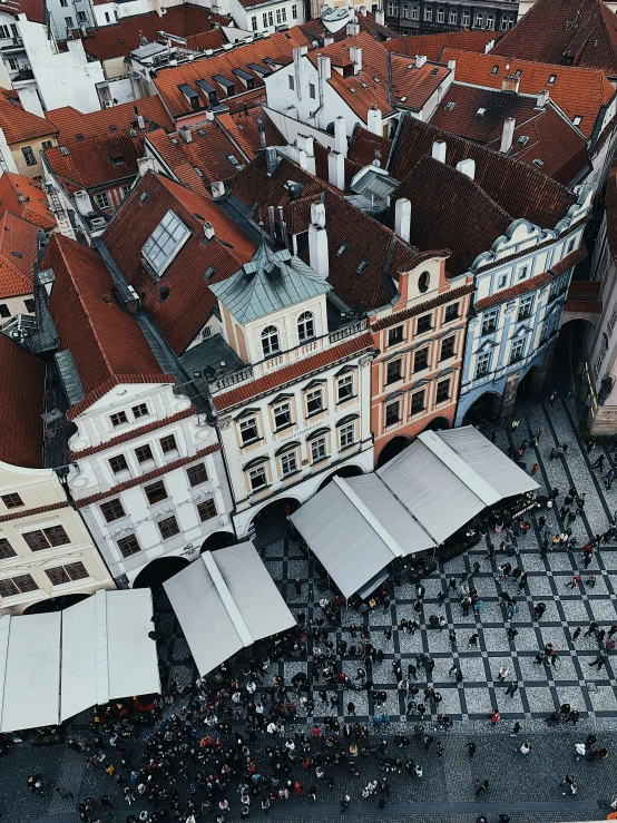 looking down on the rooftops of old buildings and surrounding businesses