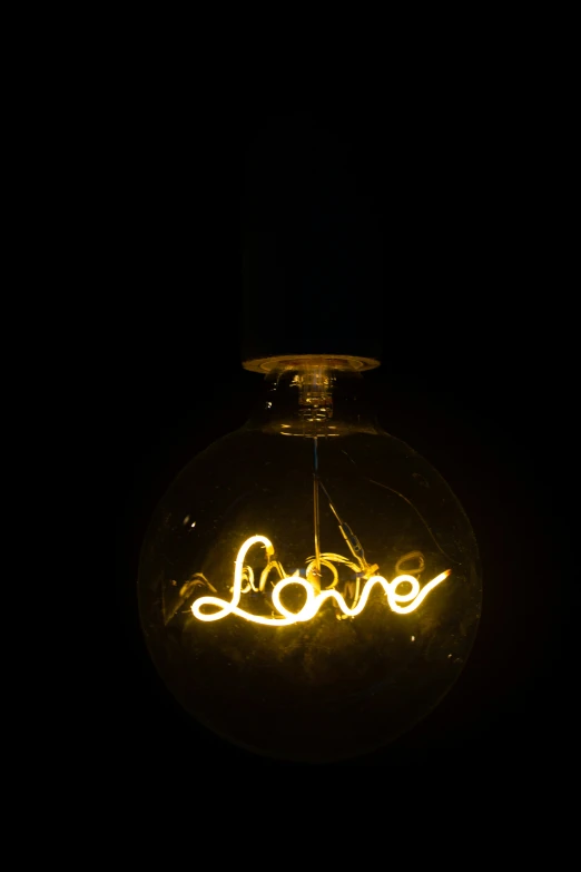 a glowing light is in a glass bottle on a black background