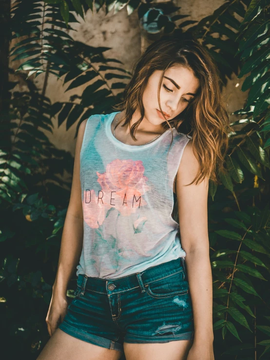 a young woman in shorts and a tank top