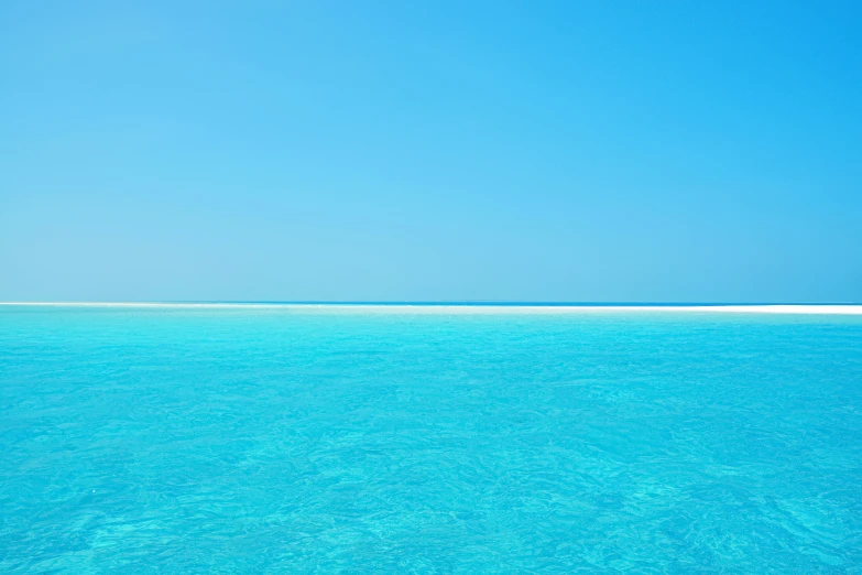 an image of the ocean with clear blue water