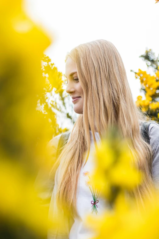 woman smiling with long hair walking in the sun