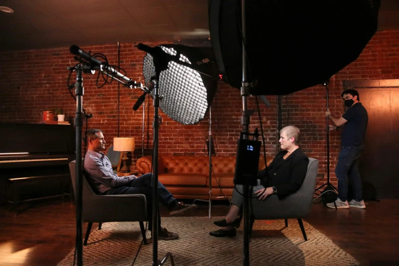 a man and woman in a po studio