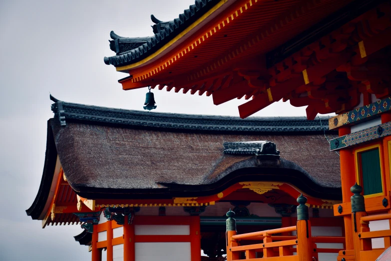 an oriental building with three tall pillars with decorations above it