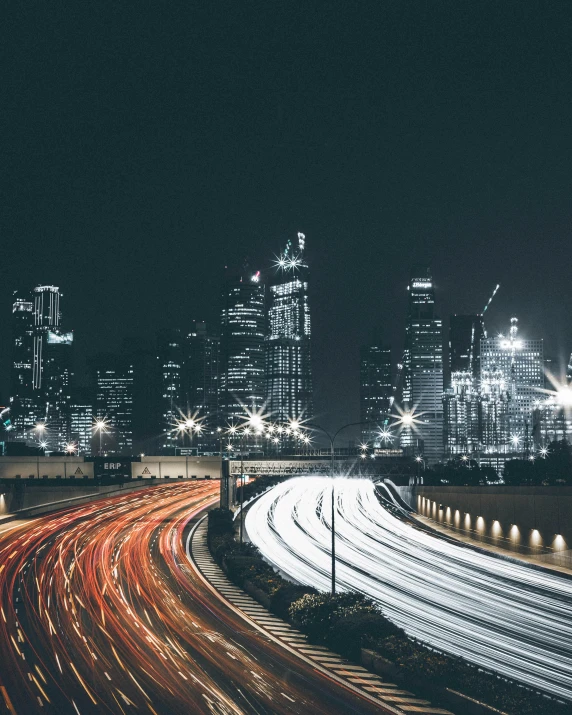 a large city skyline at night, filled with street lights