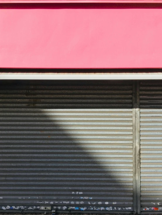 an open pink closed door with no glass on it