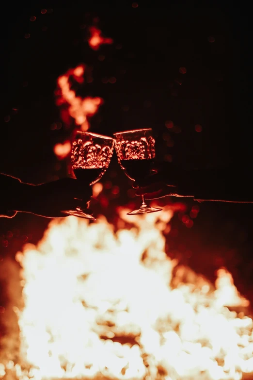 a pair of glasses are sitting on top of a fire pit