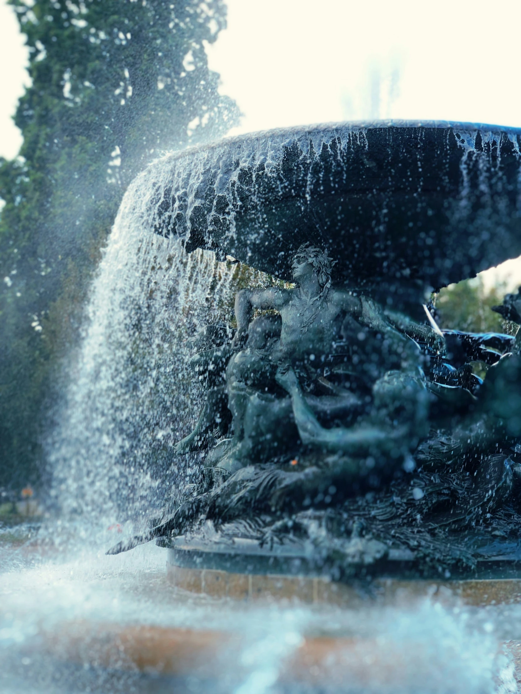 a fountain is spewing water into a lake