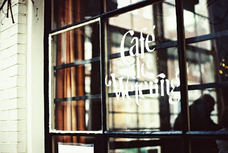 a cafe sign and a sign on the window