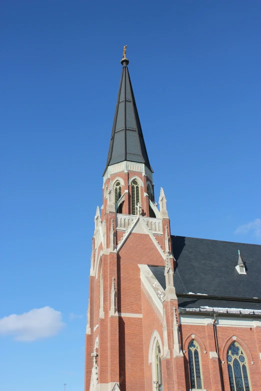 a view of a church with steeple and windows