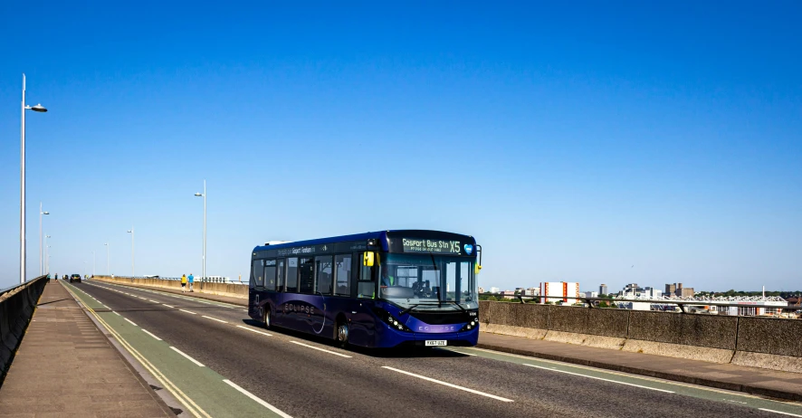 a bus that is driving down the street