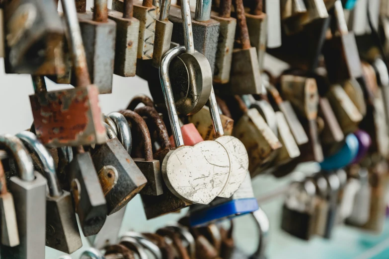 padlocks are hung to a large metal frame