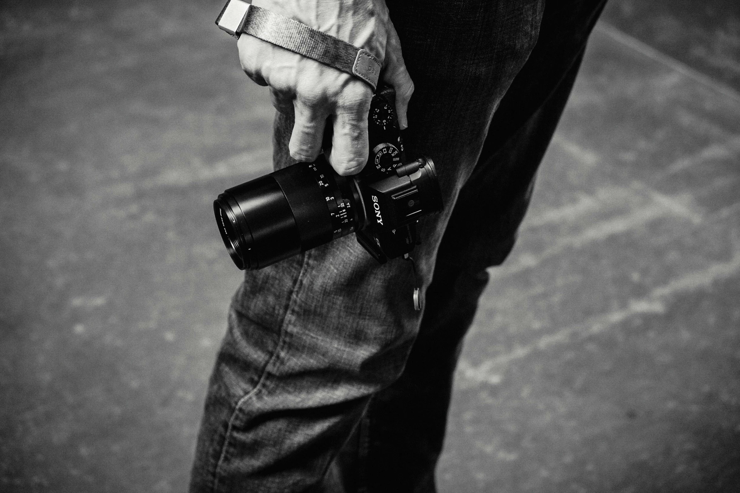 a man holds a cell phone in his left hand