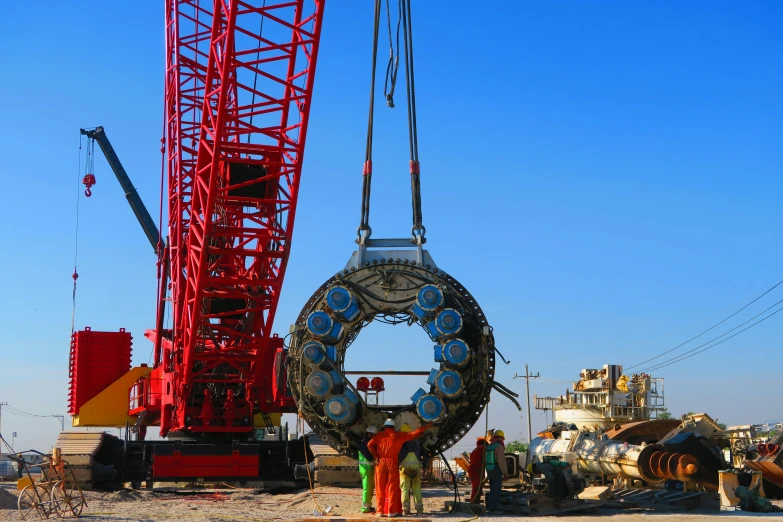 people are looking at an ornate tire that looks like an object