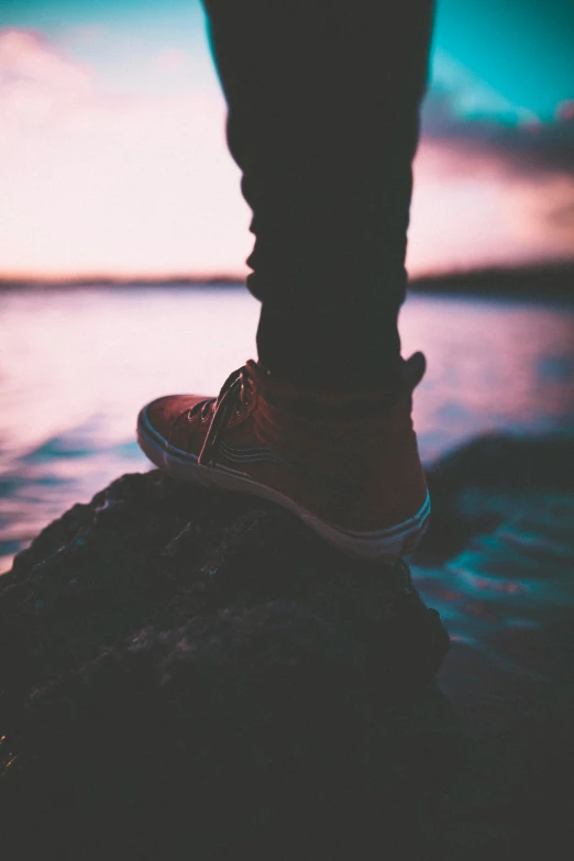 the feet of a person who is standing on the water