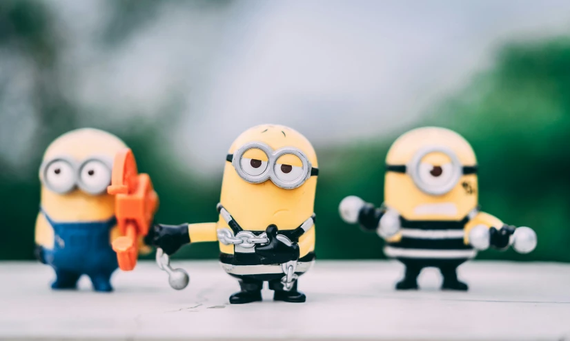 three toy toys with the faces of a minion