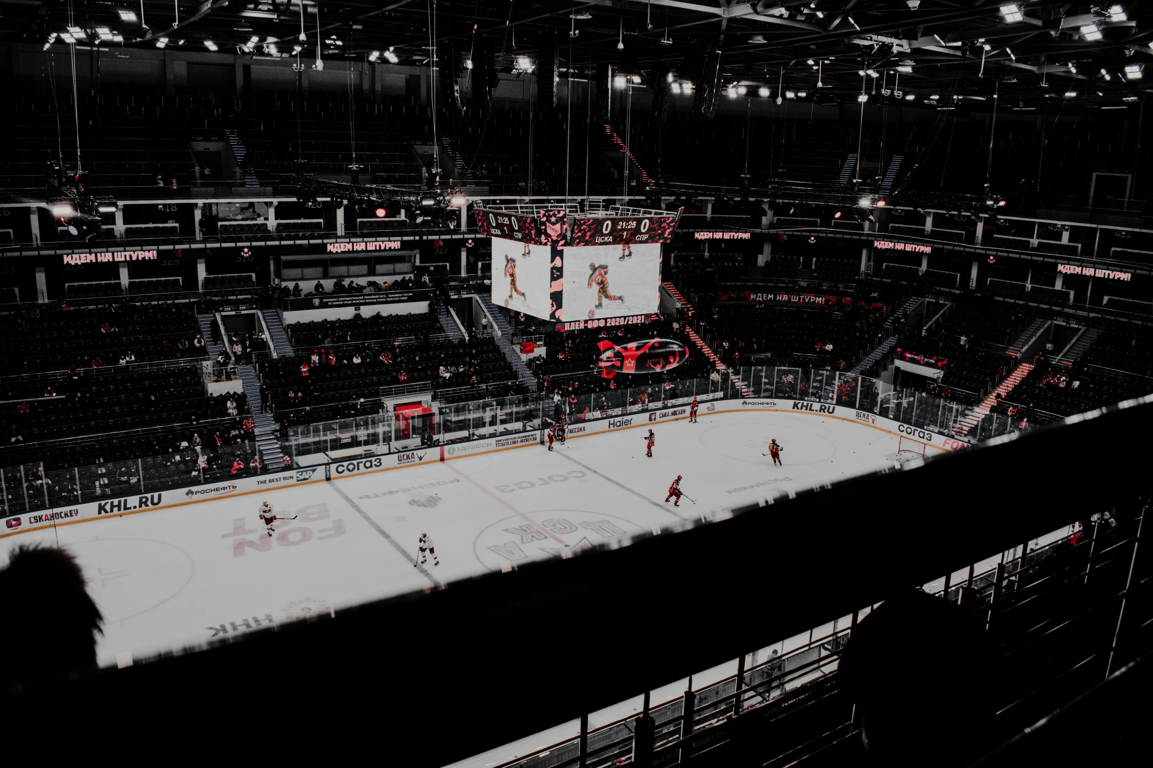 an ice rink with several people on it