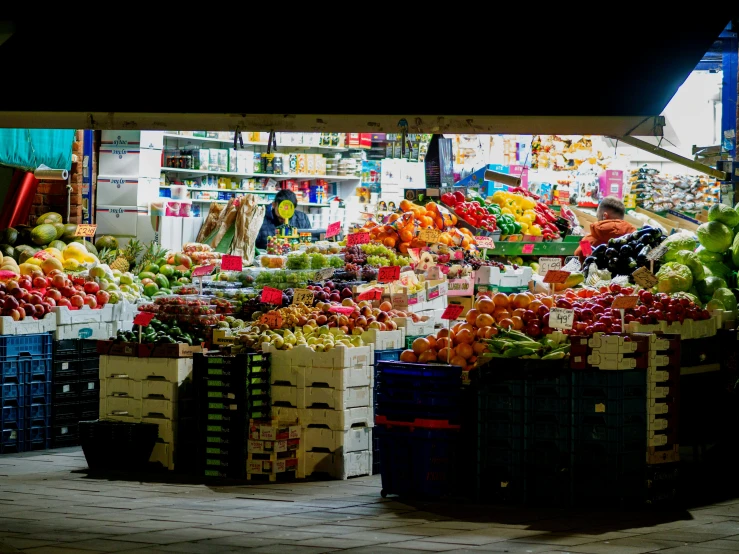 there is a produce stand with many fruits and vegetables