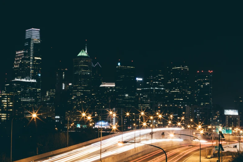 cityscape s at night, with bright lights in foreground