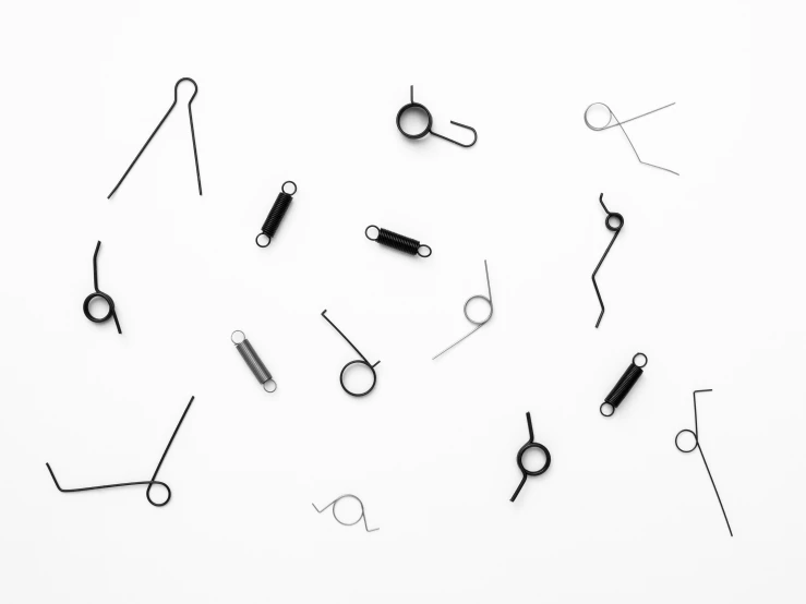 many black and white tools are on the white table