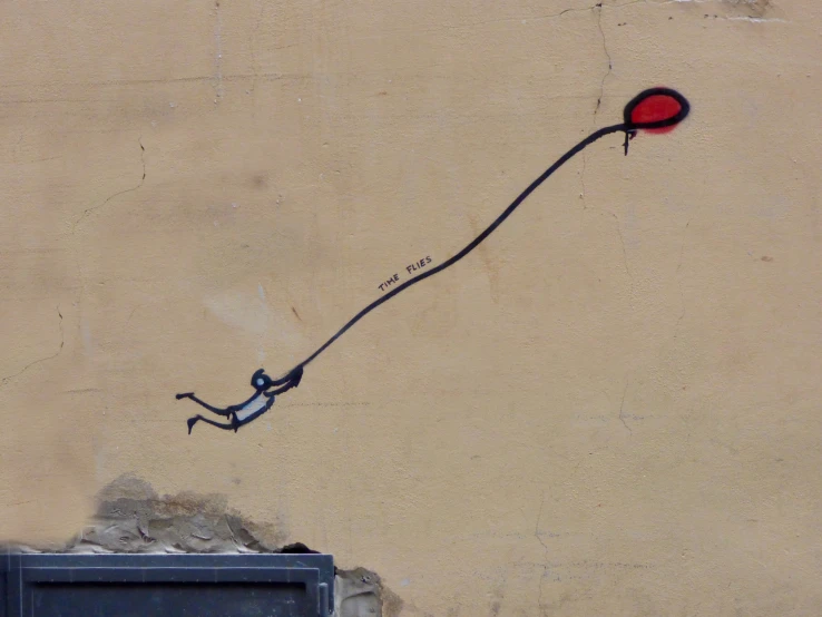 a picture of a person and a balloon on a wall