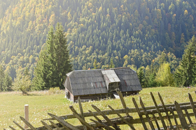 a farm building is on top of the mountains