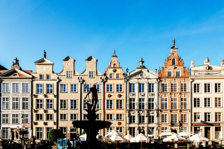 a fountain in front of an ornate building