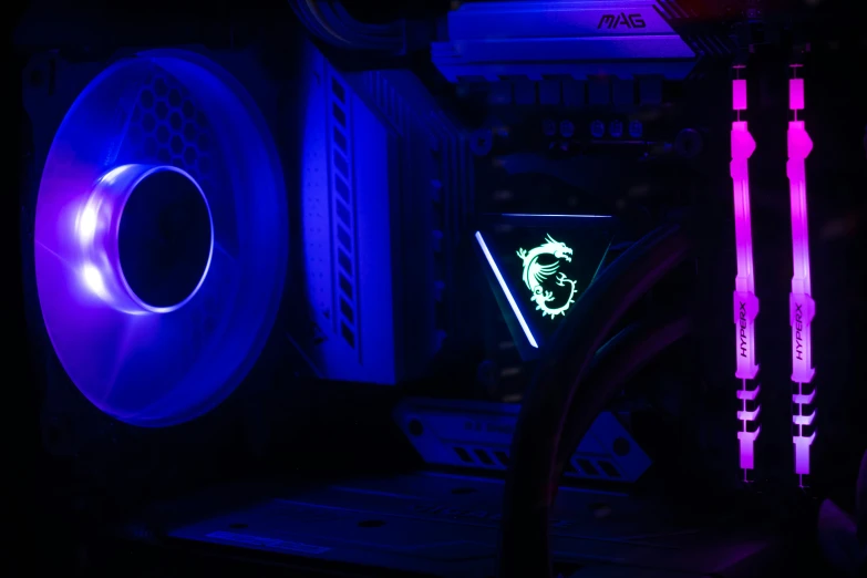 a dark room with some colorful computer equipment inside