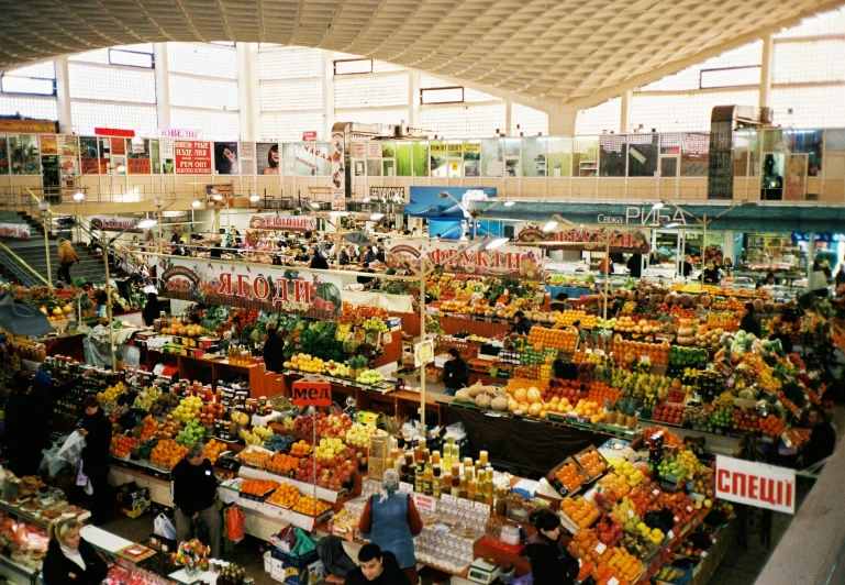 a market in an air port with lots of fruit