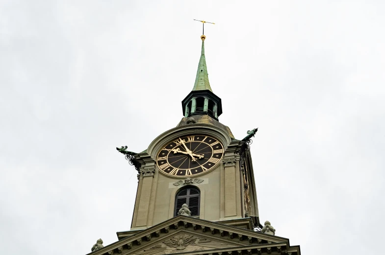 a tower with a clock on it and two clocks on each side