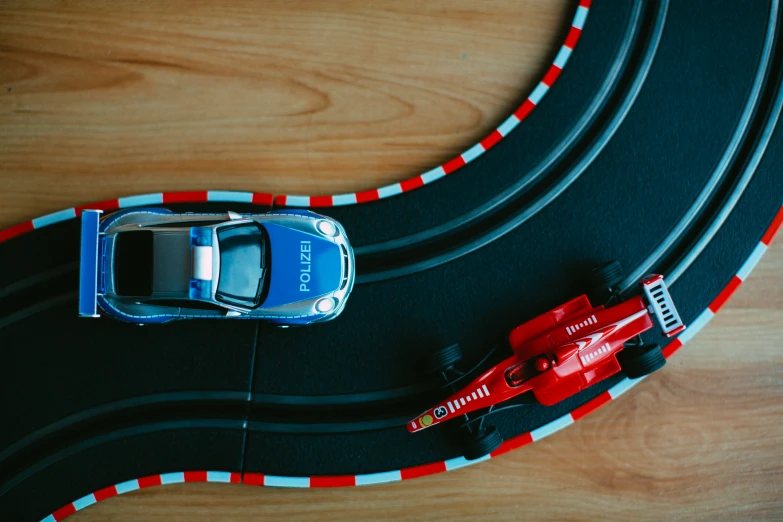 a toy car is parked next to a toy track