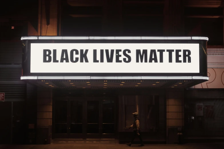 black lives matter sign at the corner of a building