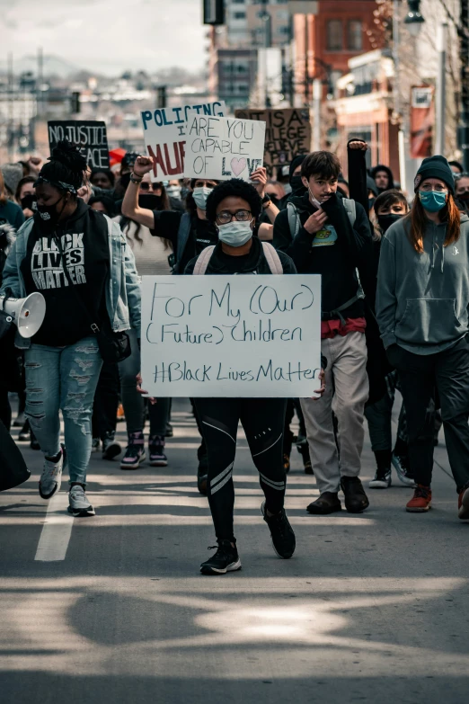 a person is protesting on a city street