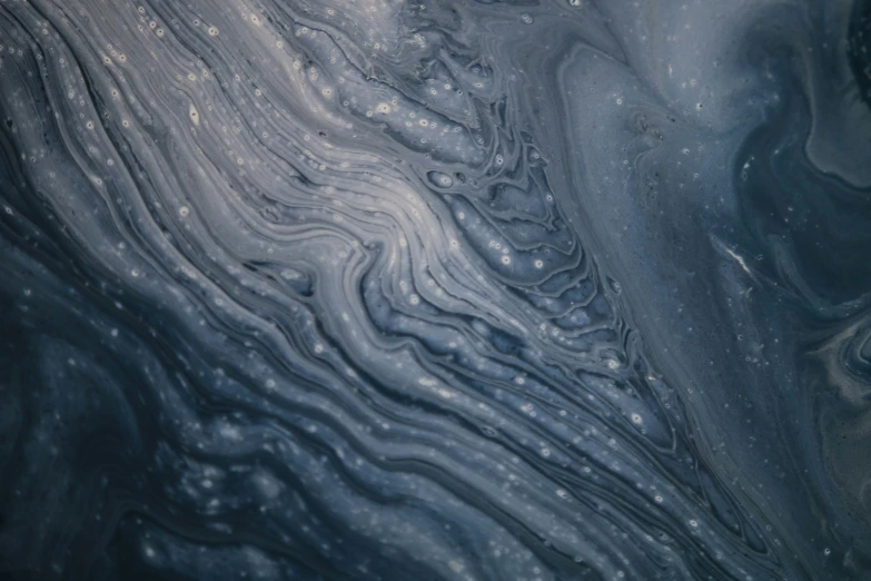 some water swirls around and is dark blue