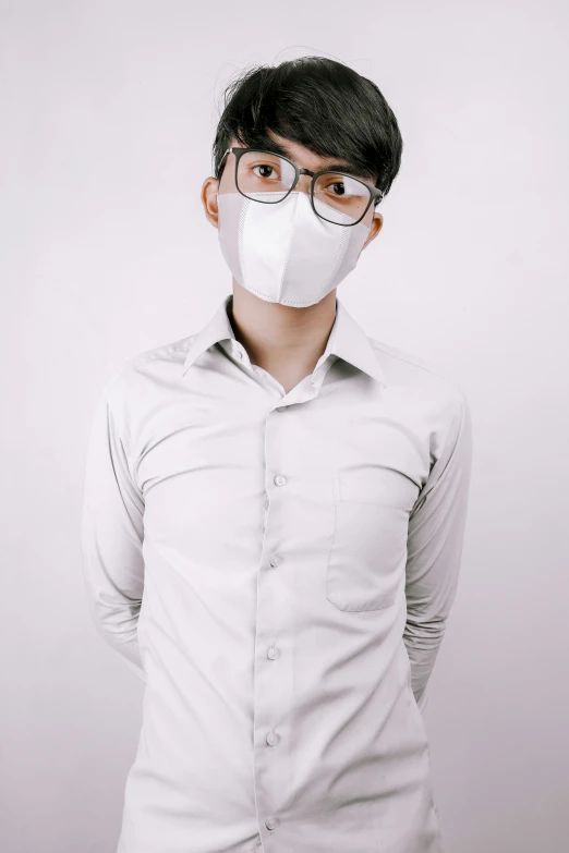a man in glasses wearing a protective mask