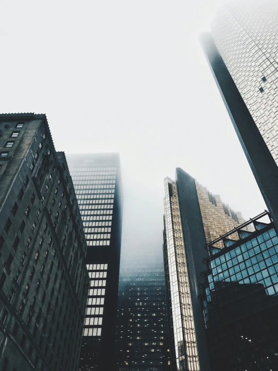 a group of tall buildings with skyscrs in the background