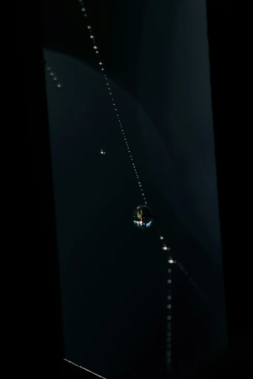 the underside of a boat on water at night
