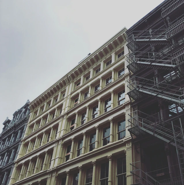 the sky is gray in color with many light colored buildings