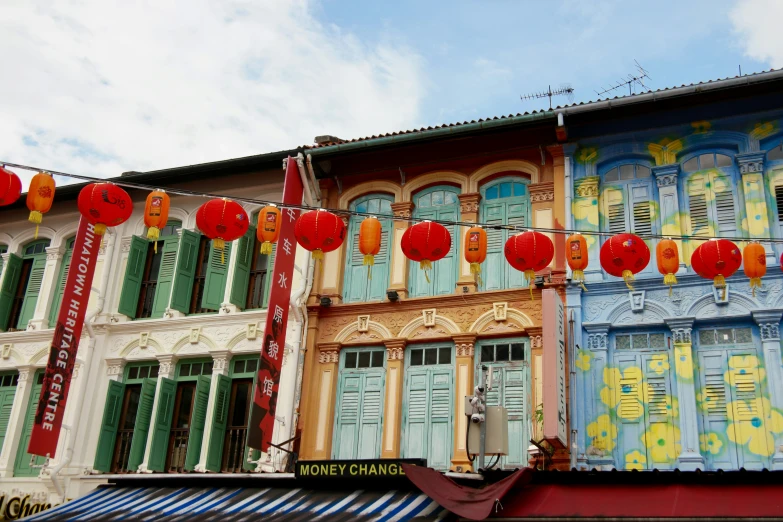 an elaborately painted building with colorful decorations on a sunny day