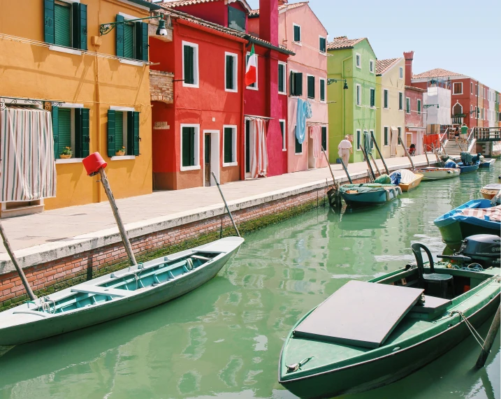 several colorful buildings sitting next to the ocean