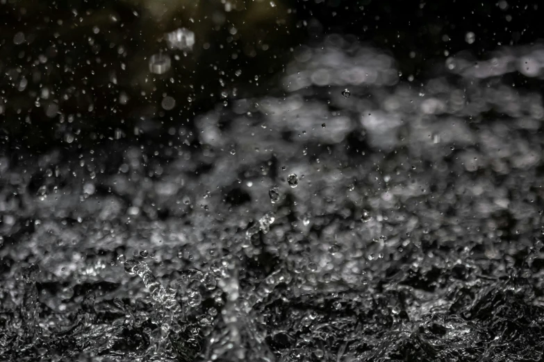 a rain shower with water falling onto the ground