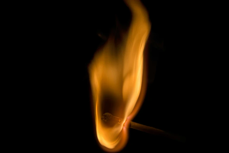 a match being burnt against a black background