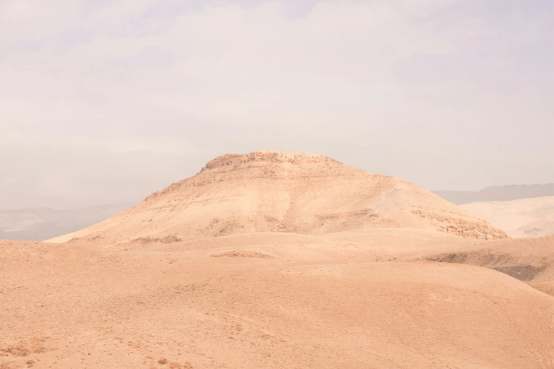 two zes in the distance with a sky background