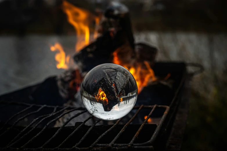 a water ball on top of an open fire pit