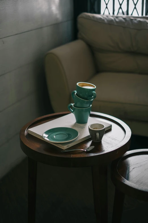 two blue dishes on a wooden table next to a couch