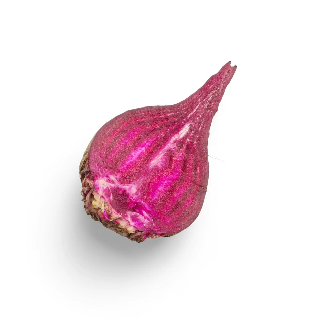 a red onion sitting on top of a white counter
