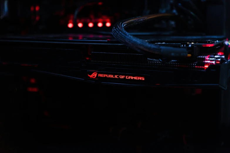 a metal and red lit gaming machine with its lights on